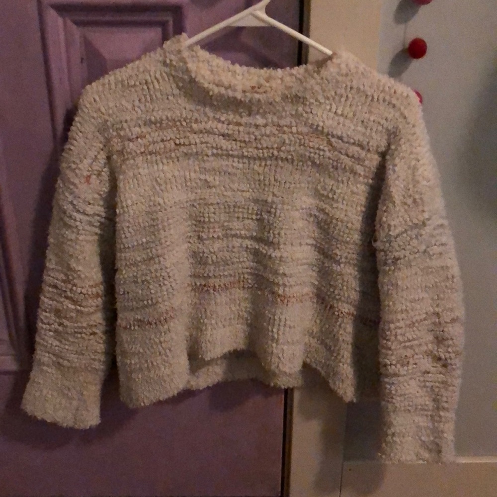 White sweater with pinks and blues